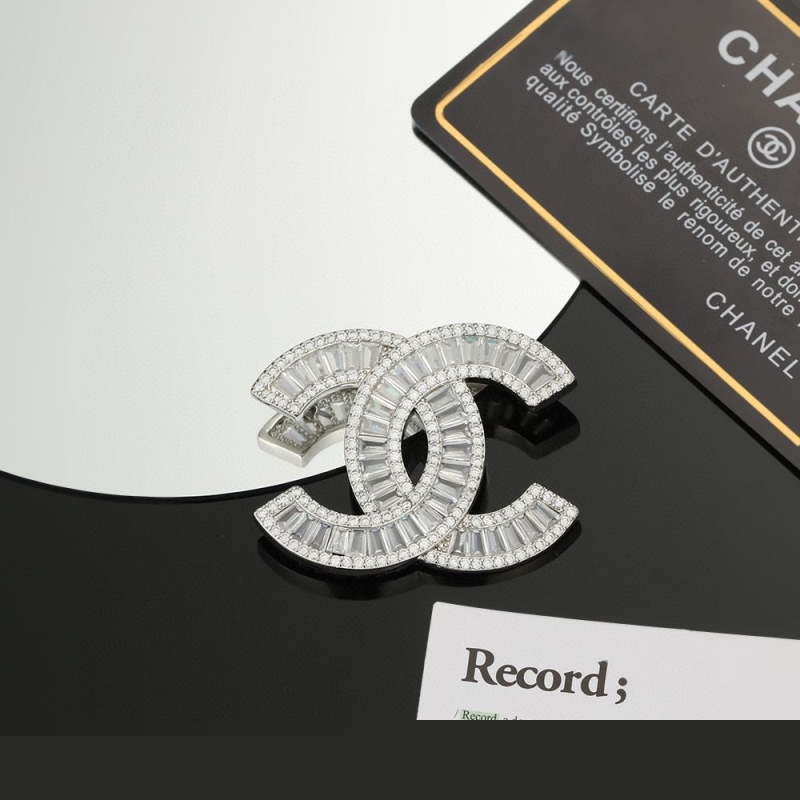Ch*el brooches